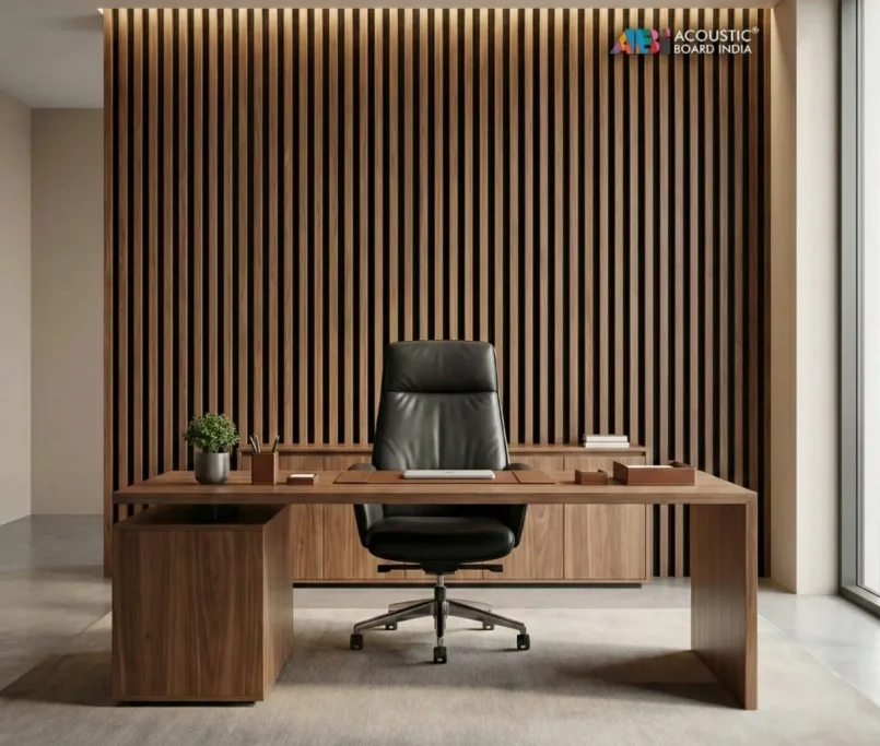 Acoustic wooden louver panels installed behind executive chair in a modern office cabin for sound absorption